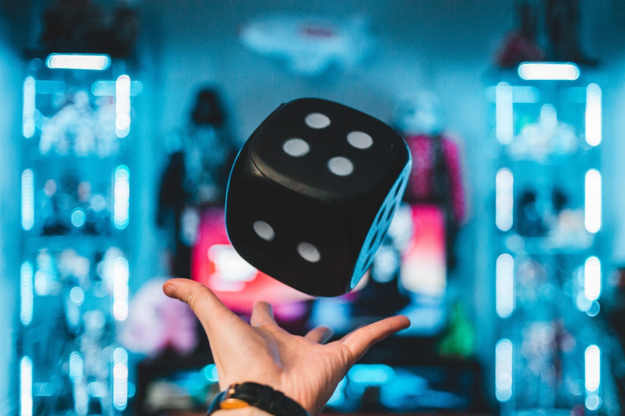 in-game shopping represented by hand tossing large dice
