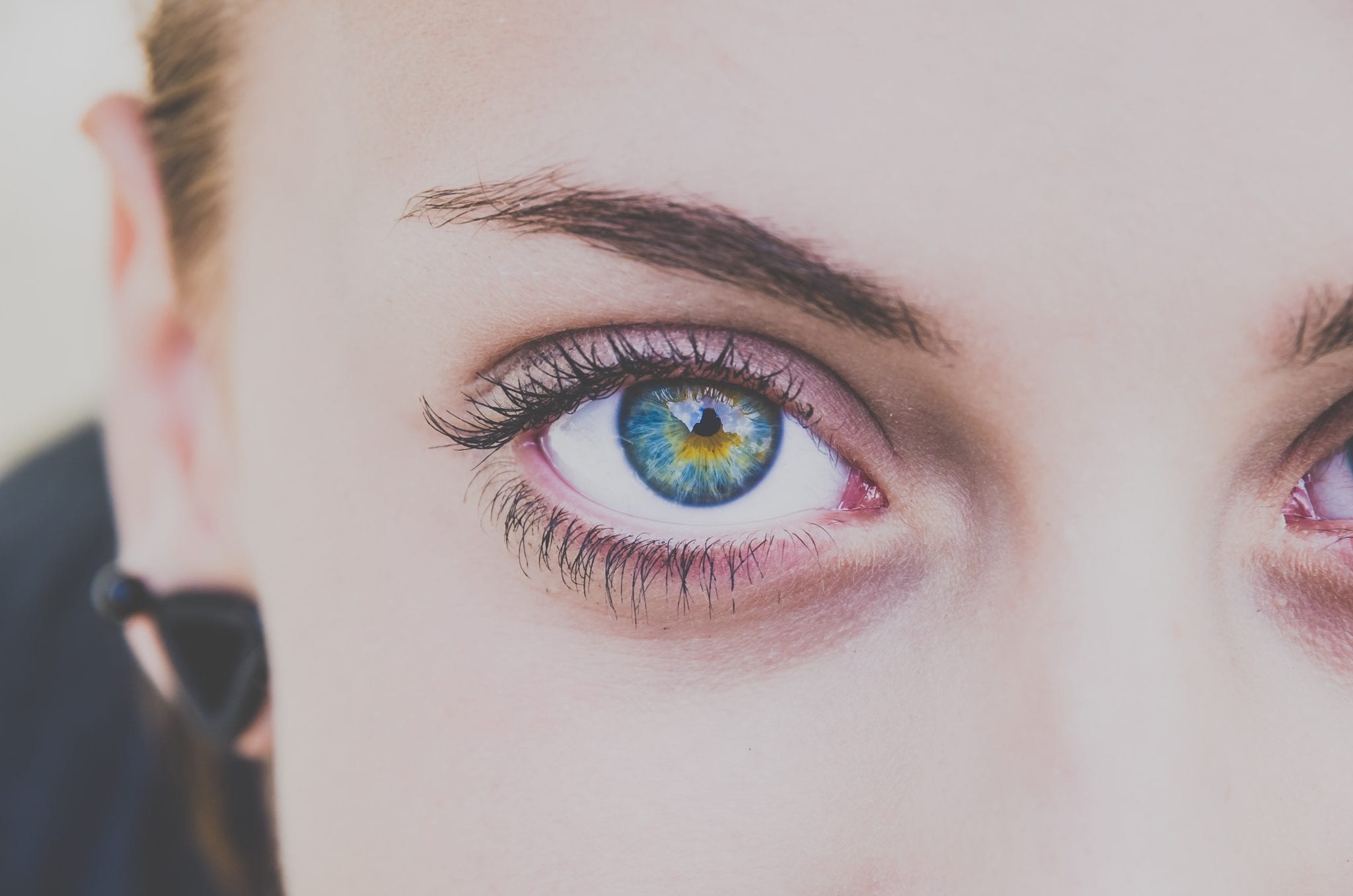 PAD testing represented by single female eye