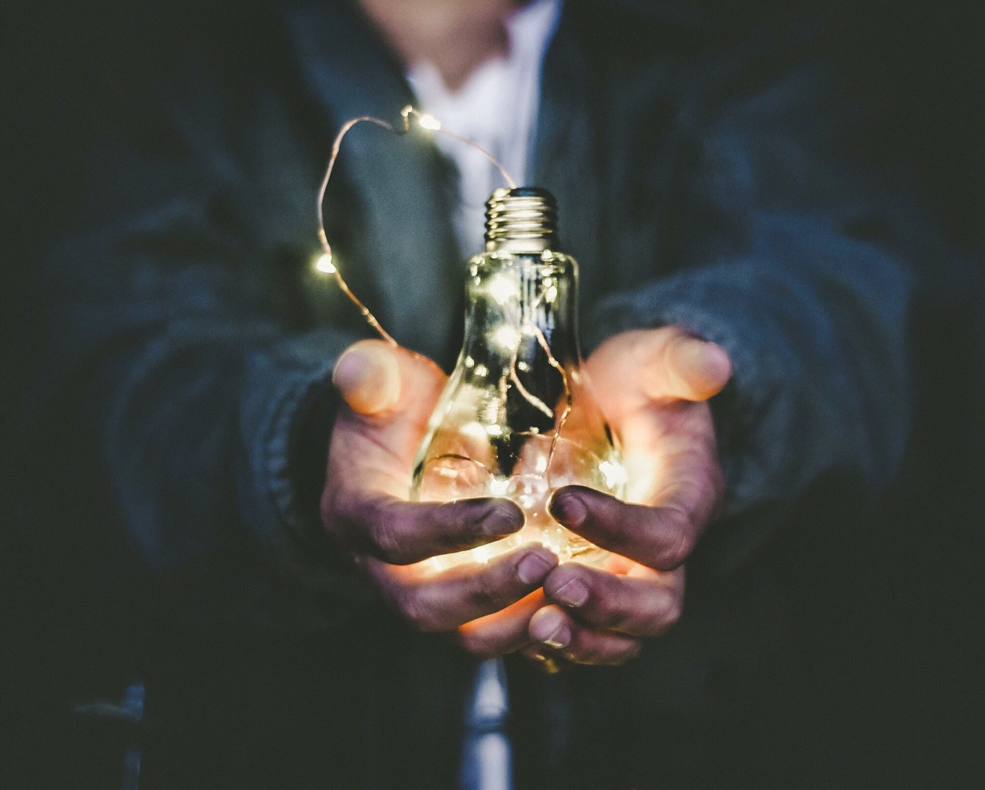 web application vulnerabilities represented by man holding light bulb