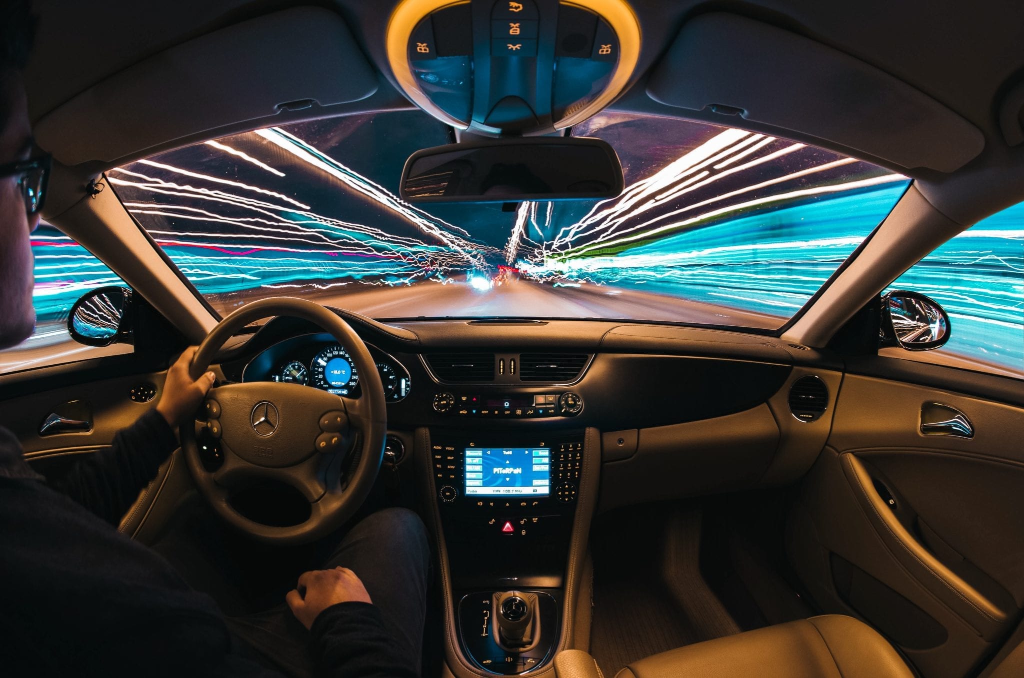 Cybersecurity and IoT Electronics represented by car dash and street lights