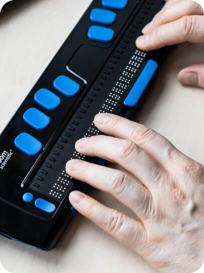 img - moscow-russia-june-2021-fingers-read-focus-blue-braille-display