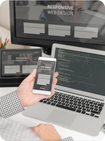 web-designer-programmer-working-responsive-web-template-multiple-devices-desk